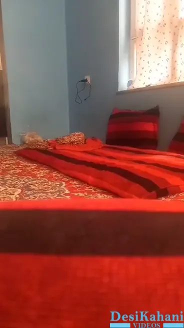 Pakistani couple created a ruckus on the bed wearing a red sheet.